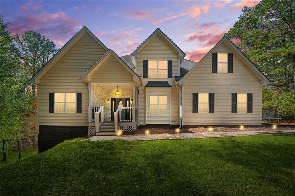a front view of a house with a yard