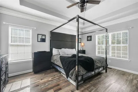 a spacious bathroom with a shower sink and mirror
