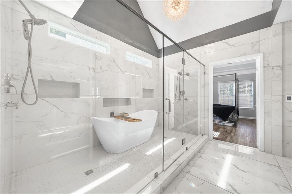 4835 Liberty Road Villa Rica, GA 30180 - Photo 24 of 72 a bathroom with a glass shower door and a glass door shower