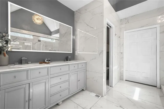 a view of a hallway with wooden floor and entryway
