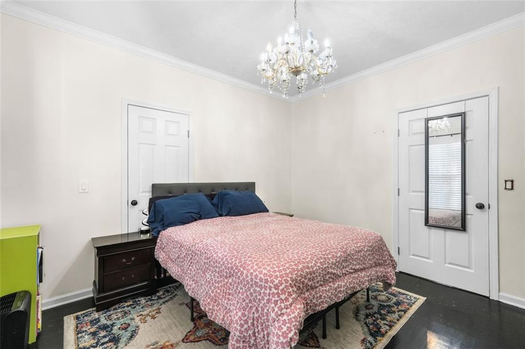 4835 Liberty Road Villa Rica, GA 30180 - Photo 31 of 72 a bedroom with a bed and wooden floor