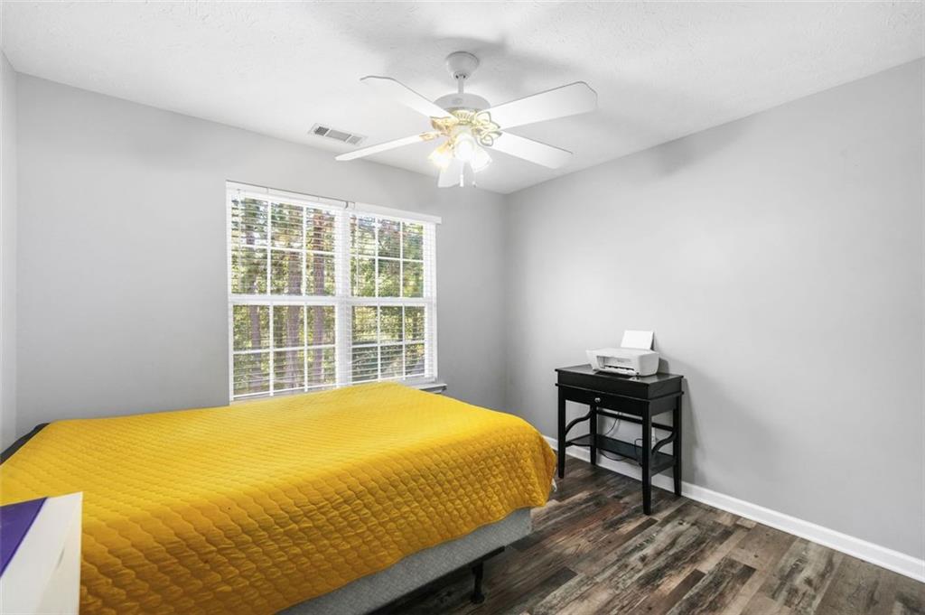 4835 Liberty Road Villa Rica, GA 30180 - Photo 38 of 72 a bed sitting in a bedroom next to a window