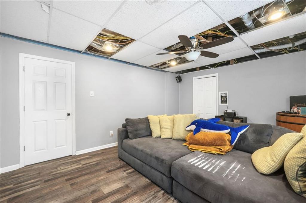 4835 Liberty Road Villa Rica, GA 30180 - Photo 43 of 72 a living room with furniture and a wooden floor