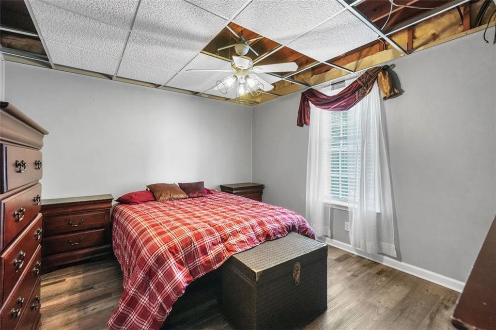 4835 Liberty Road Villa Rica, GA 30180 - Photo 44 of 72 a bedroom with a bed and a chandelier