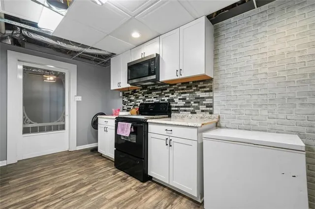 an aerial view of house with yard