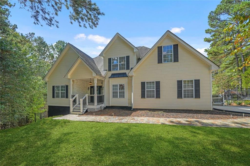4835 Liberty Road Villa Rica, GA 30180 - Photo 9 of 72 a front view of a house with a yard