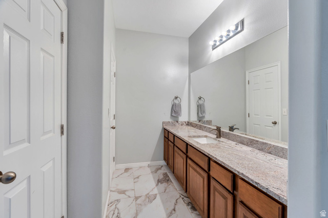 11007 Birch Creek Road South Jordan, UT 84095 - Photo 13 of 35 Large granite vanity and warm cabinetry