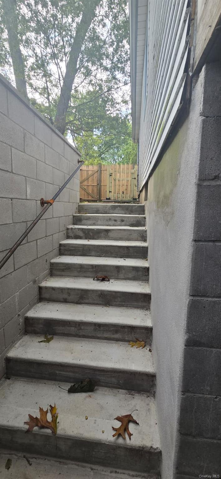51 Peconic Street Selden, NY 11784 - Photo 4 of 16 a view of entryway with wooden floor
