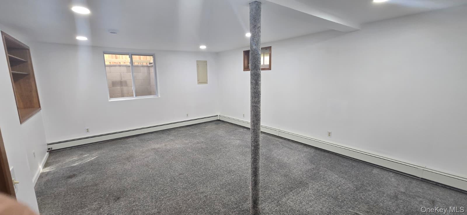 51 Peconic Street Selden, NY 11784 - Photo 6 of 16 an empty room with windows