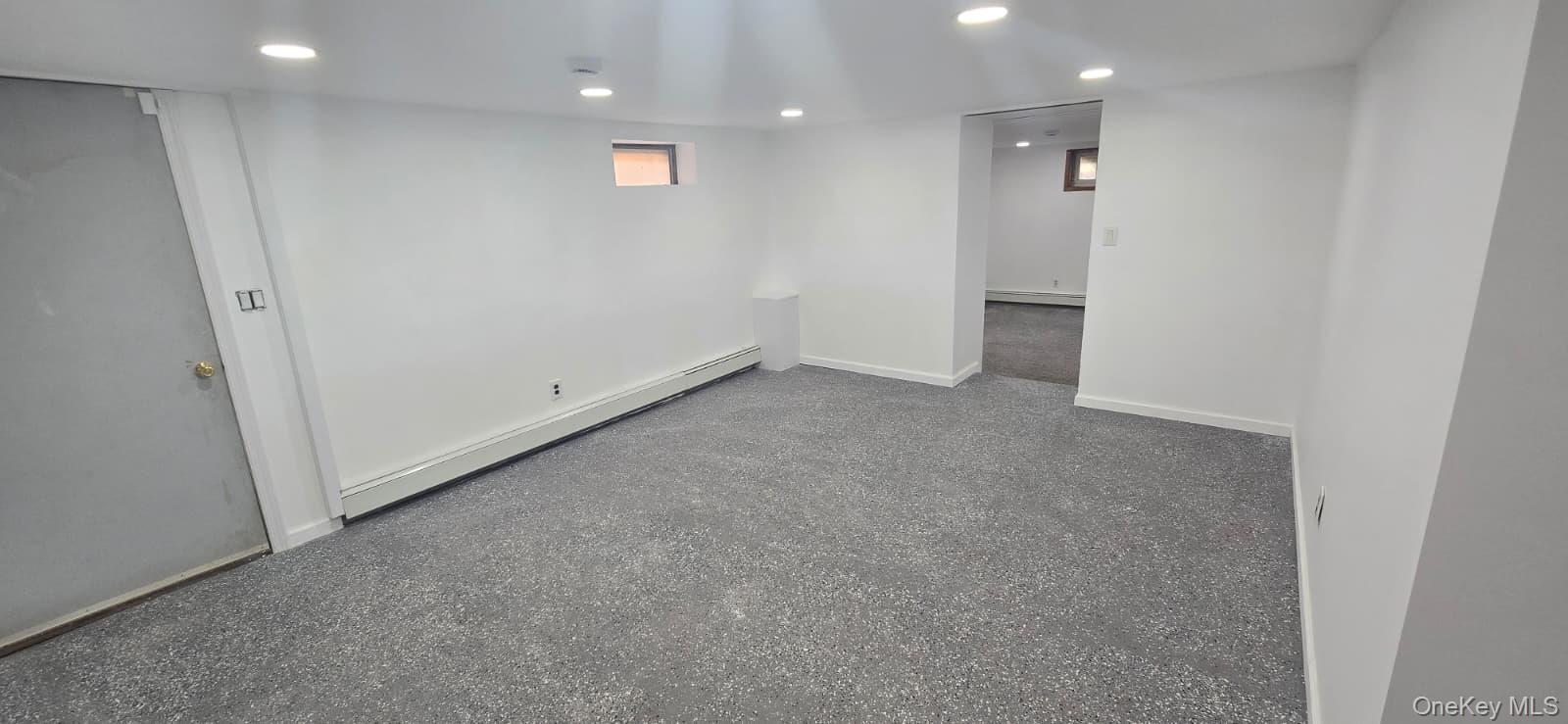 51 Peconic Street Selden, NY 11784 - Photo 10 of 16 an empty room with an entryway
