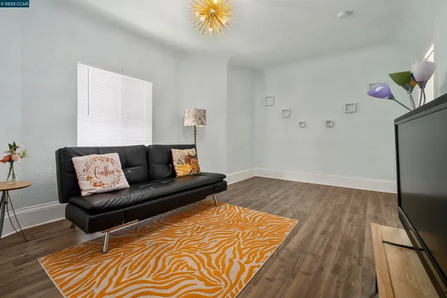 a living room with a couch and a rug