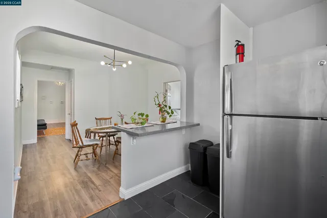 a view of kitchen with furniture and wooden floor