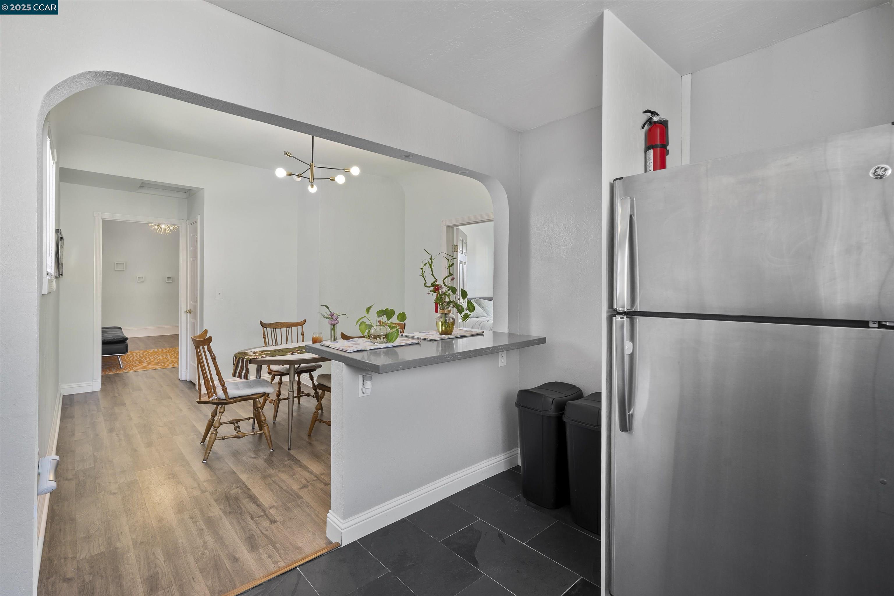 874 36th Street Oakland, CA 94608 - Photo 15 of 41 a view of kitchen with furniture and wooden floor