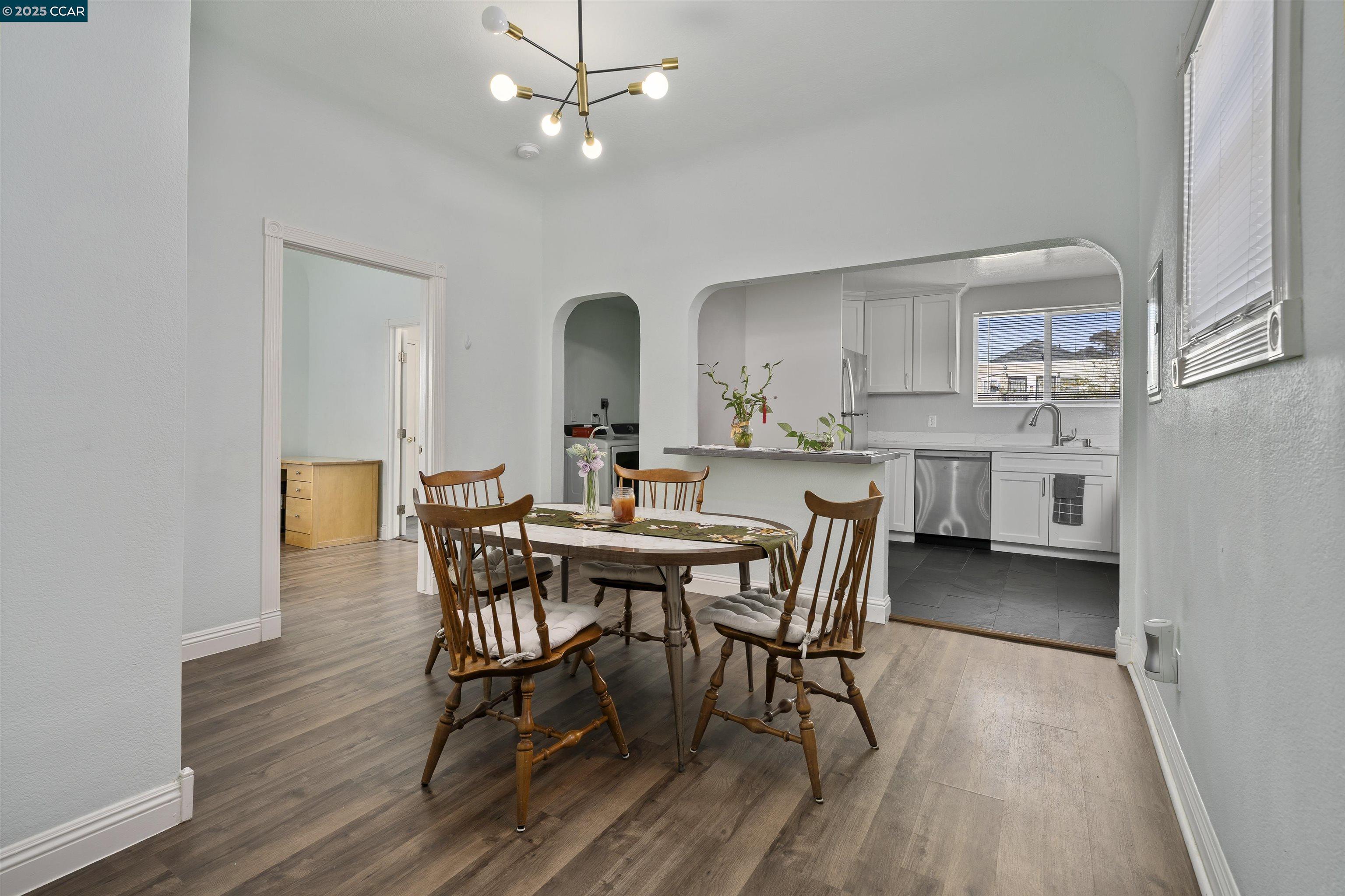874 36th Street Oakland, CA 94608 - Photo 16 of 41 a view of a dining room with furniture and wooden floor