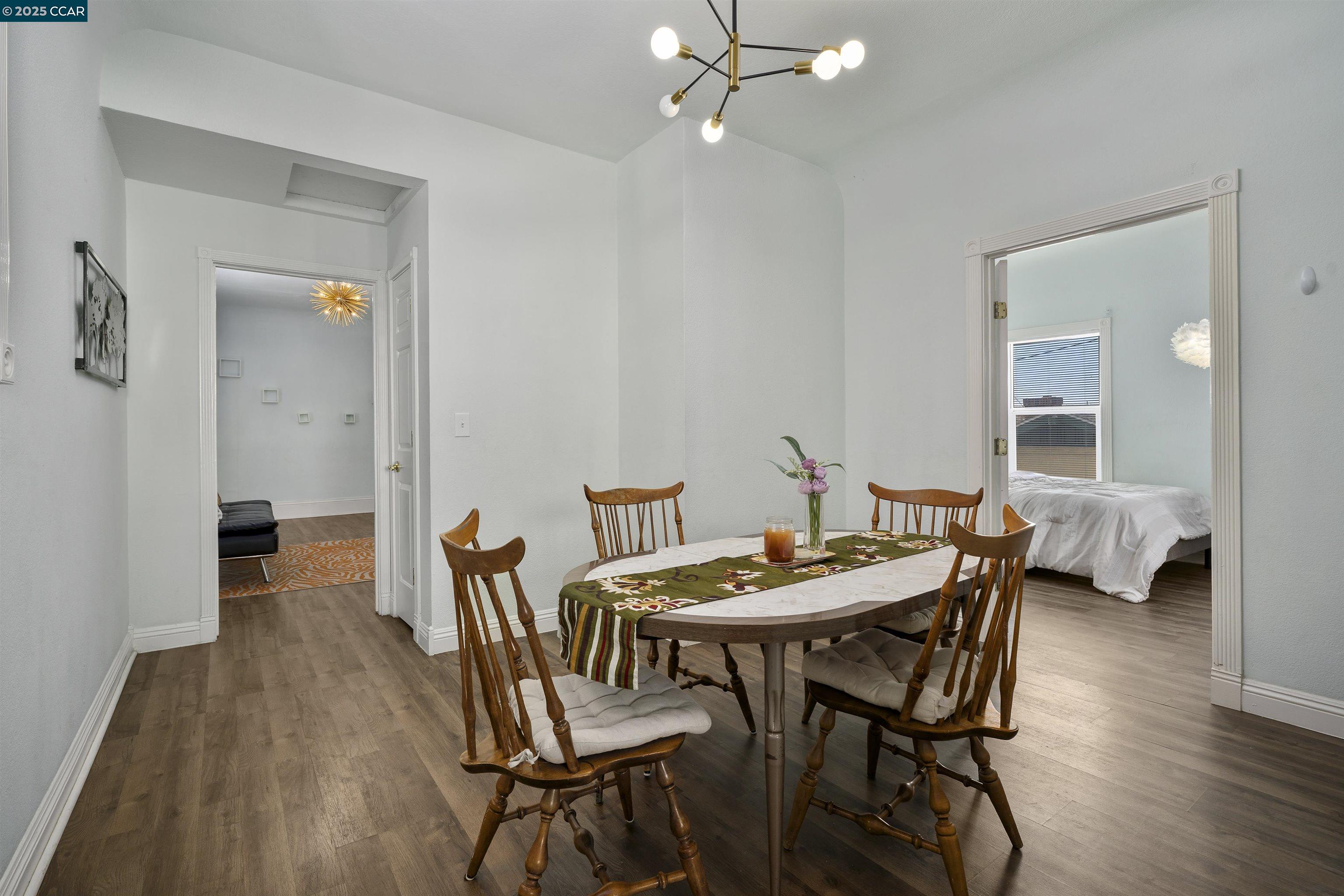 874 36th Street Oakland, CA 94608 - Photo 17 of 41 a view of a dining room with furniture and wooden floor