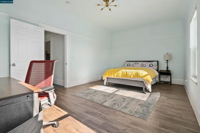 a room with a bed and a chair