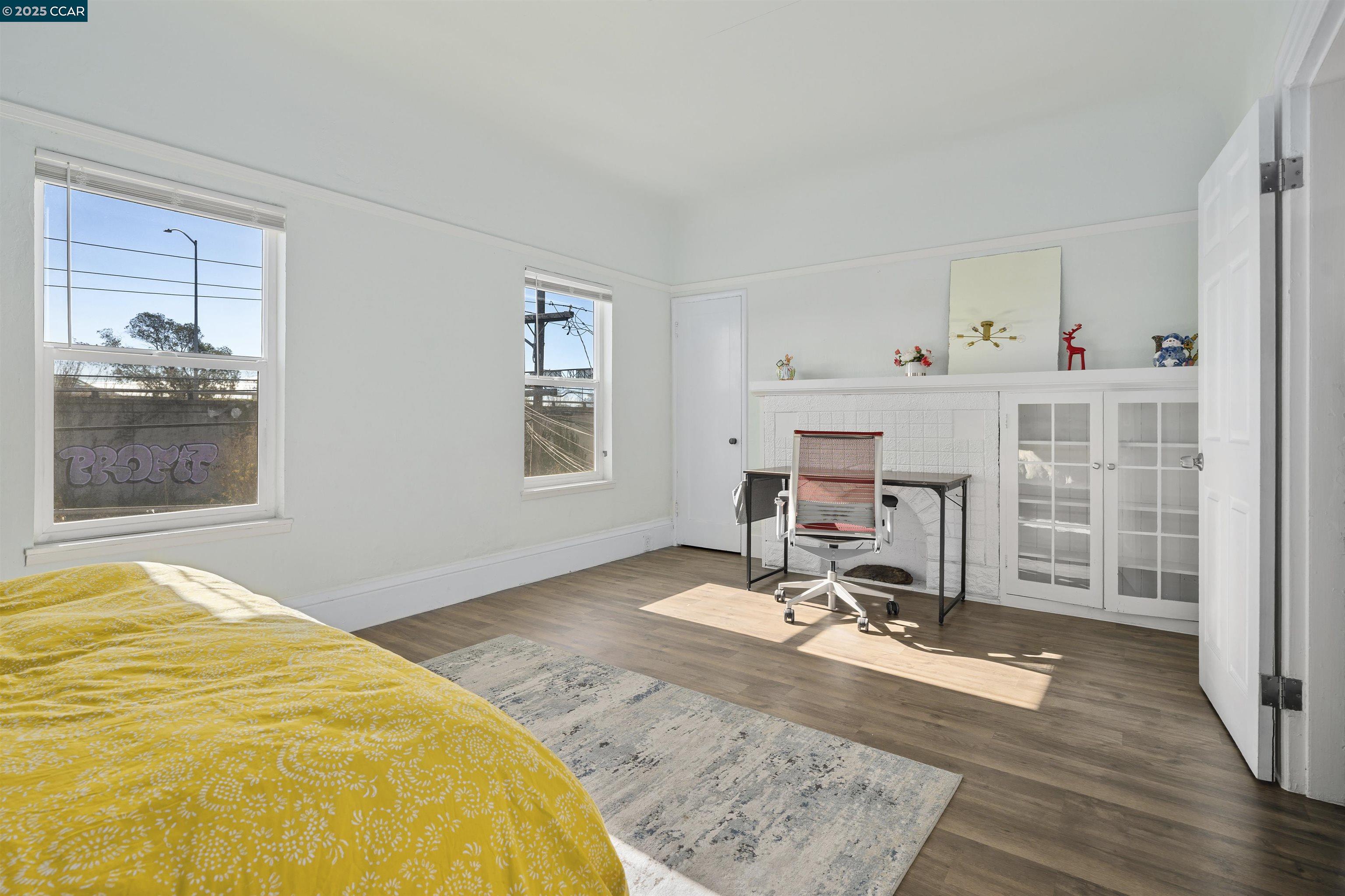 874 36th Street Oakland, CA 94608 - Photo 20 of 41 a room with a bed and glass window