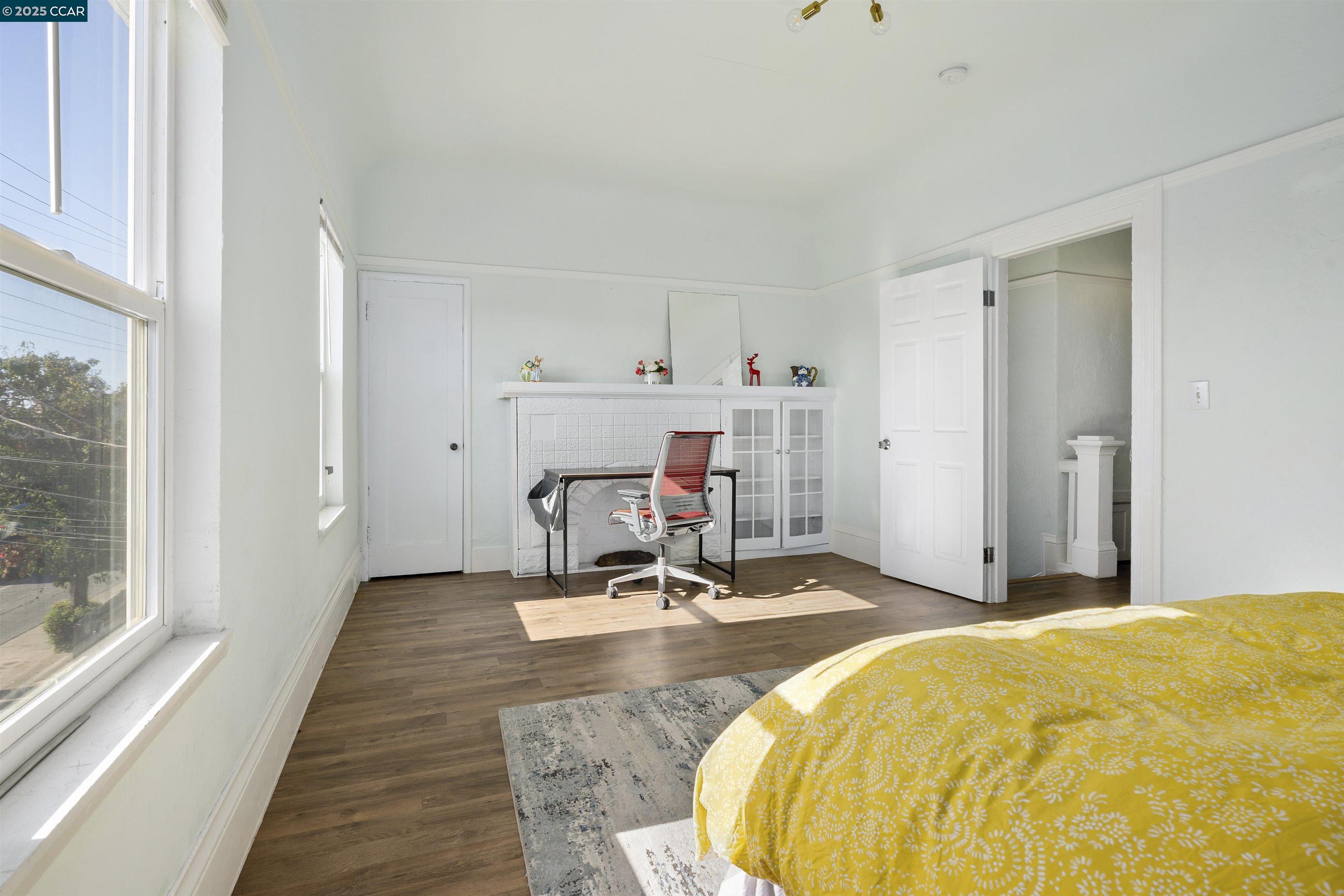 874 36th Street Oakland, CA 94608 - Photo 21 of 41 a bed room with a bed and table