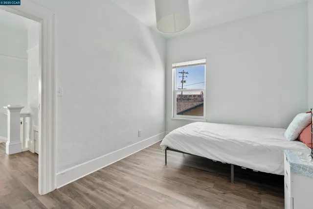 a bedroom with a bed and a table