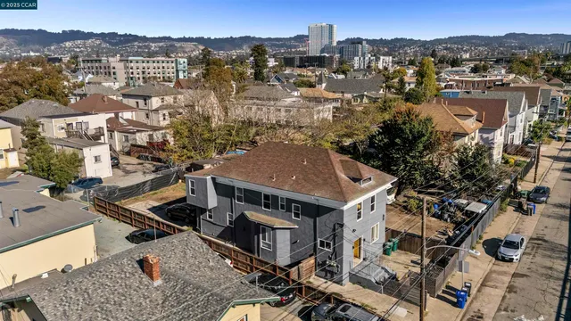 an aerial view of residential houses with outdoor space