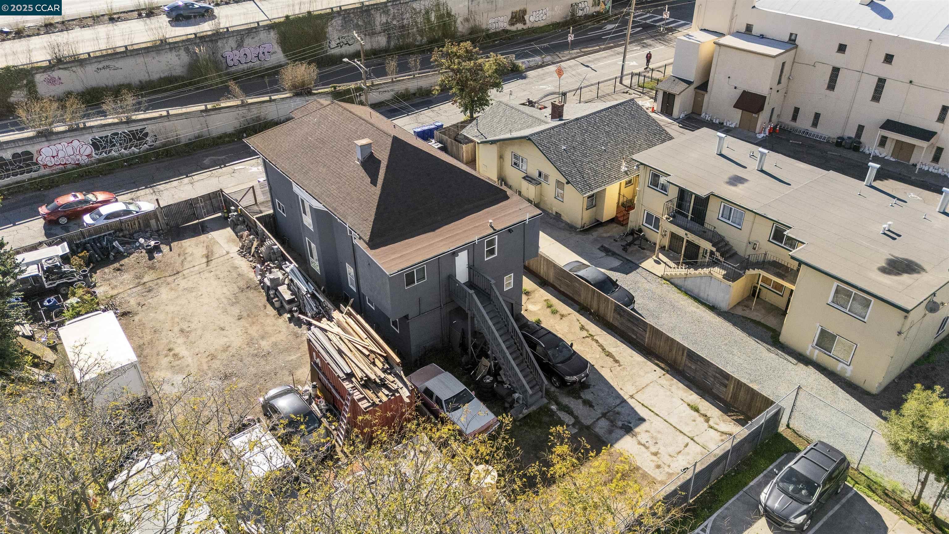 874 36th Street Oakland, CA 94608 - Photo 38 of 41 an aerial view of a residential apartment building with a yard