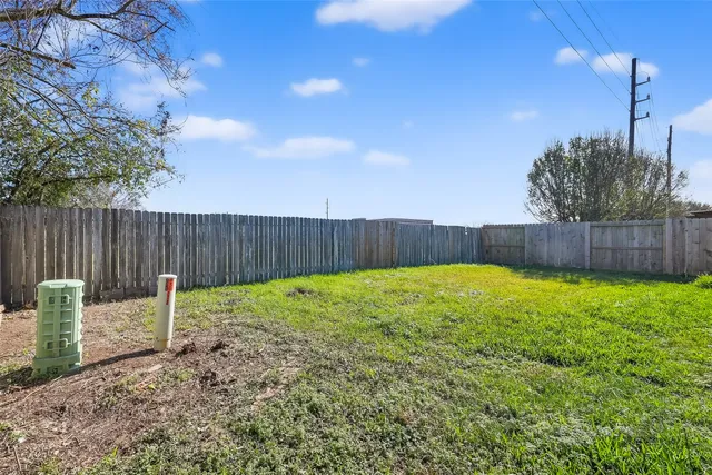 a view of a backyard with a swing