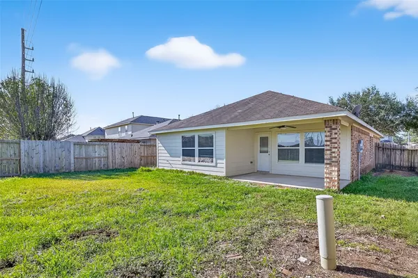 a view of a house with a yard and a garden