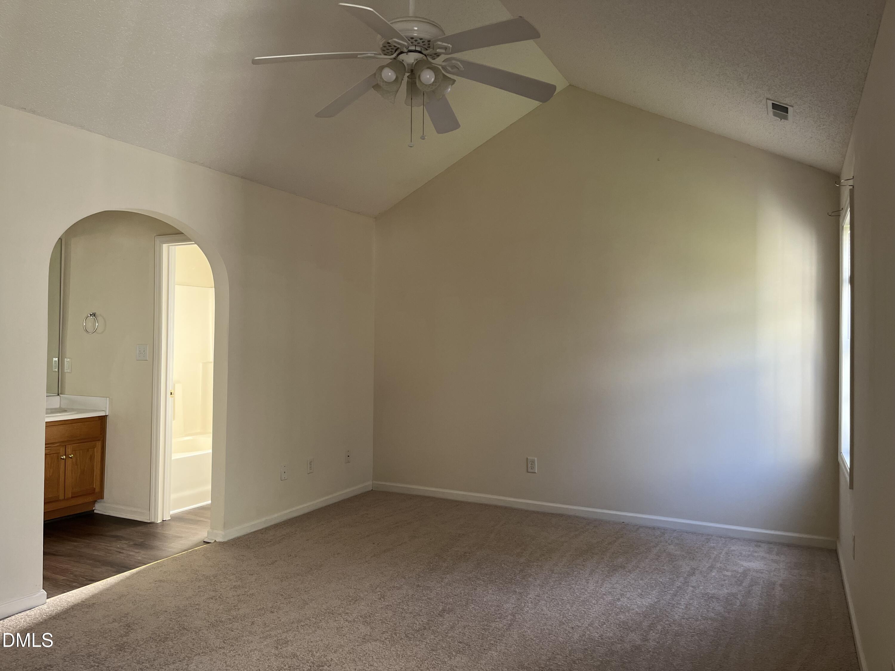 2604 Farlow Gap Lane Raleigh, NC 27603 - Photo 18 of 28 an empty room with a ceiling fan and a window
