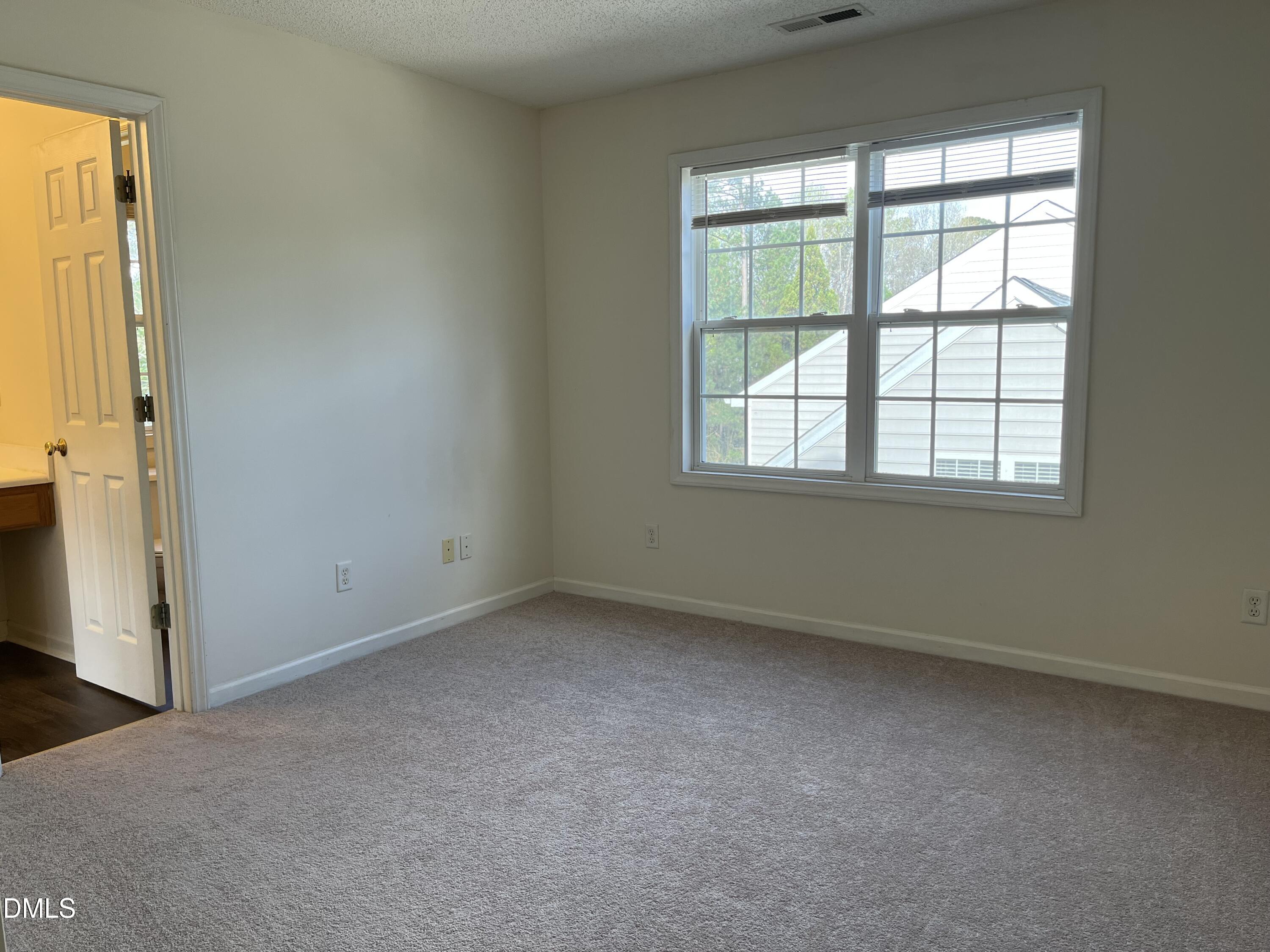 2604 Farlow Gap Lane Raleigh, NC 27603 - Photo 22 of 28 an empty room with a window