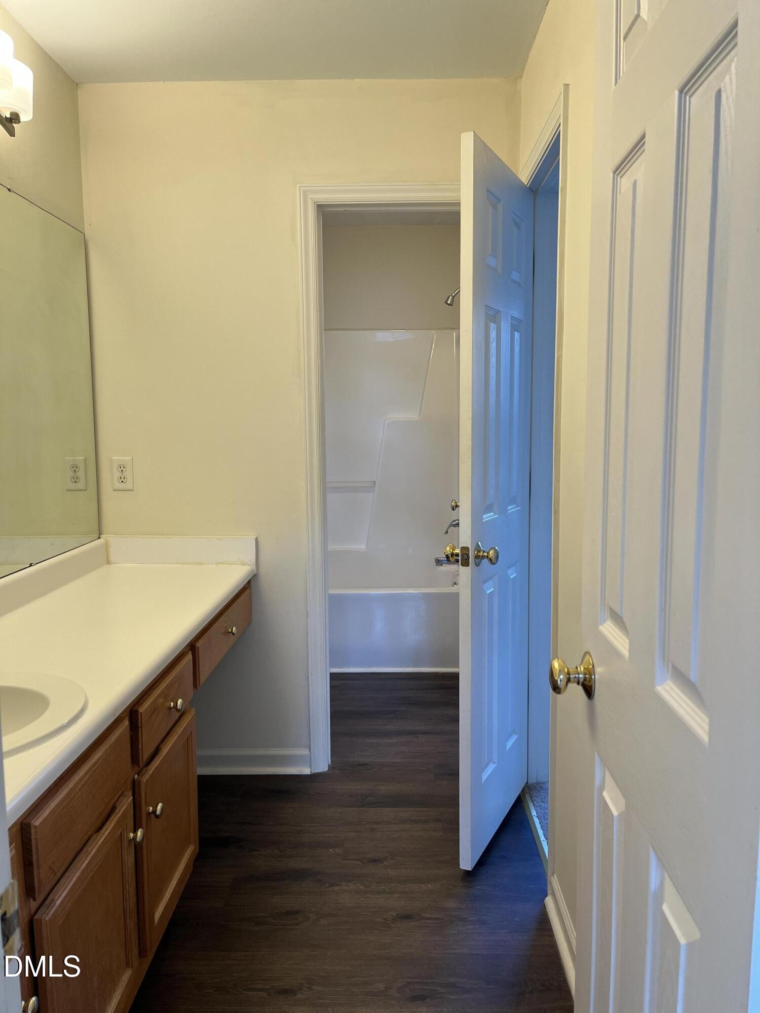 2604 Farlow Gap Lane Raleigh, NC 27603 - Photo 23 of 28 a bathroom with a sink and a mirror