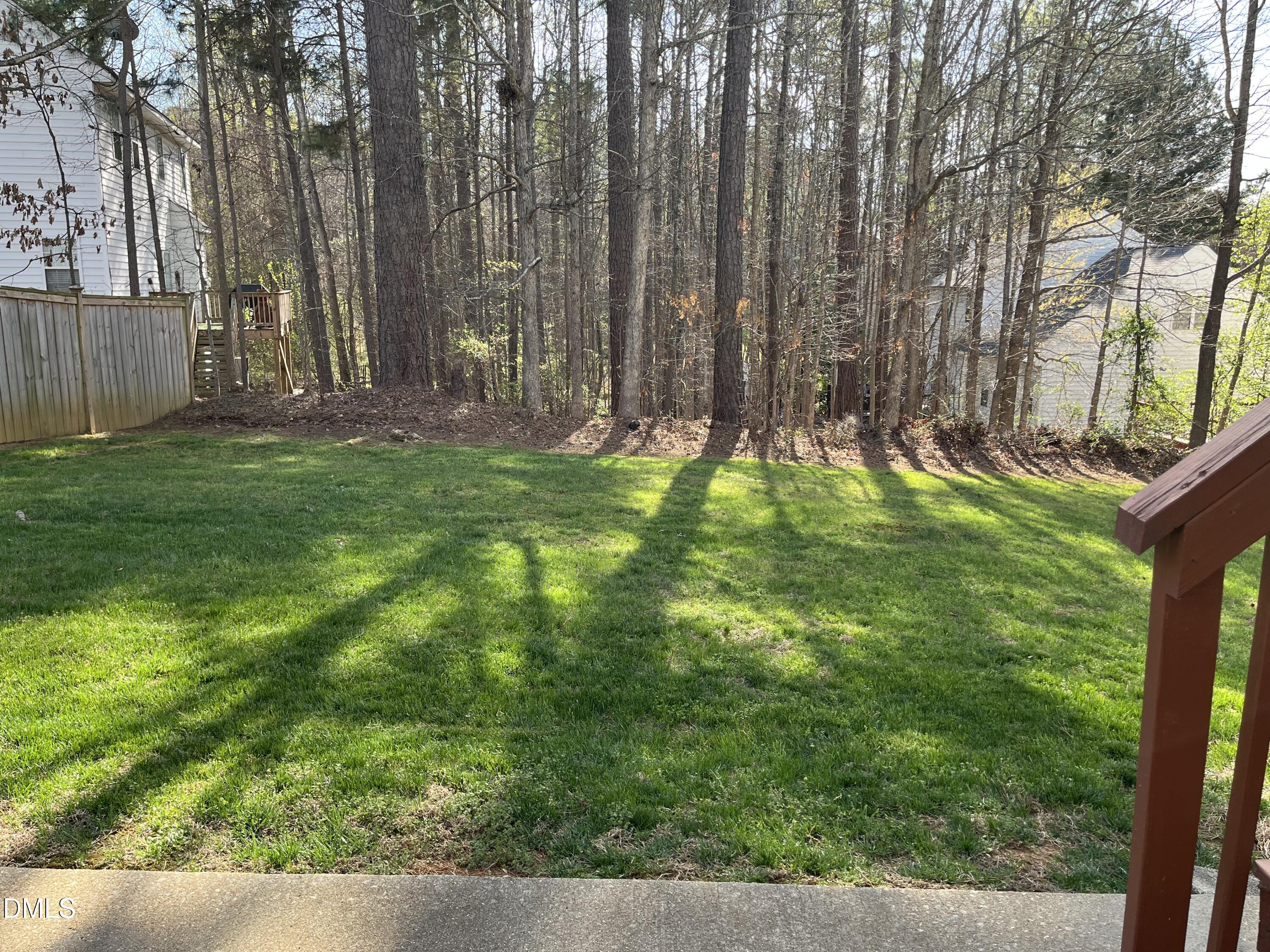 2604 Farlow Gap Lane Raleigh, NC 27603 - Photo 3 of 28 a backyard of a house with lots of green space