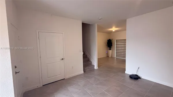 a view of walk in closet with clothes