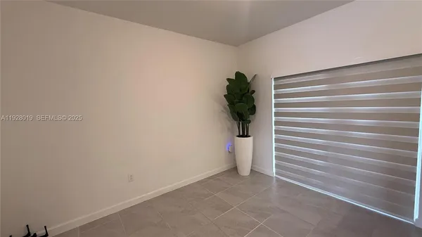 a kitchen with stainless steel appliances a refrigerator a stove a microwave and a refrigerator