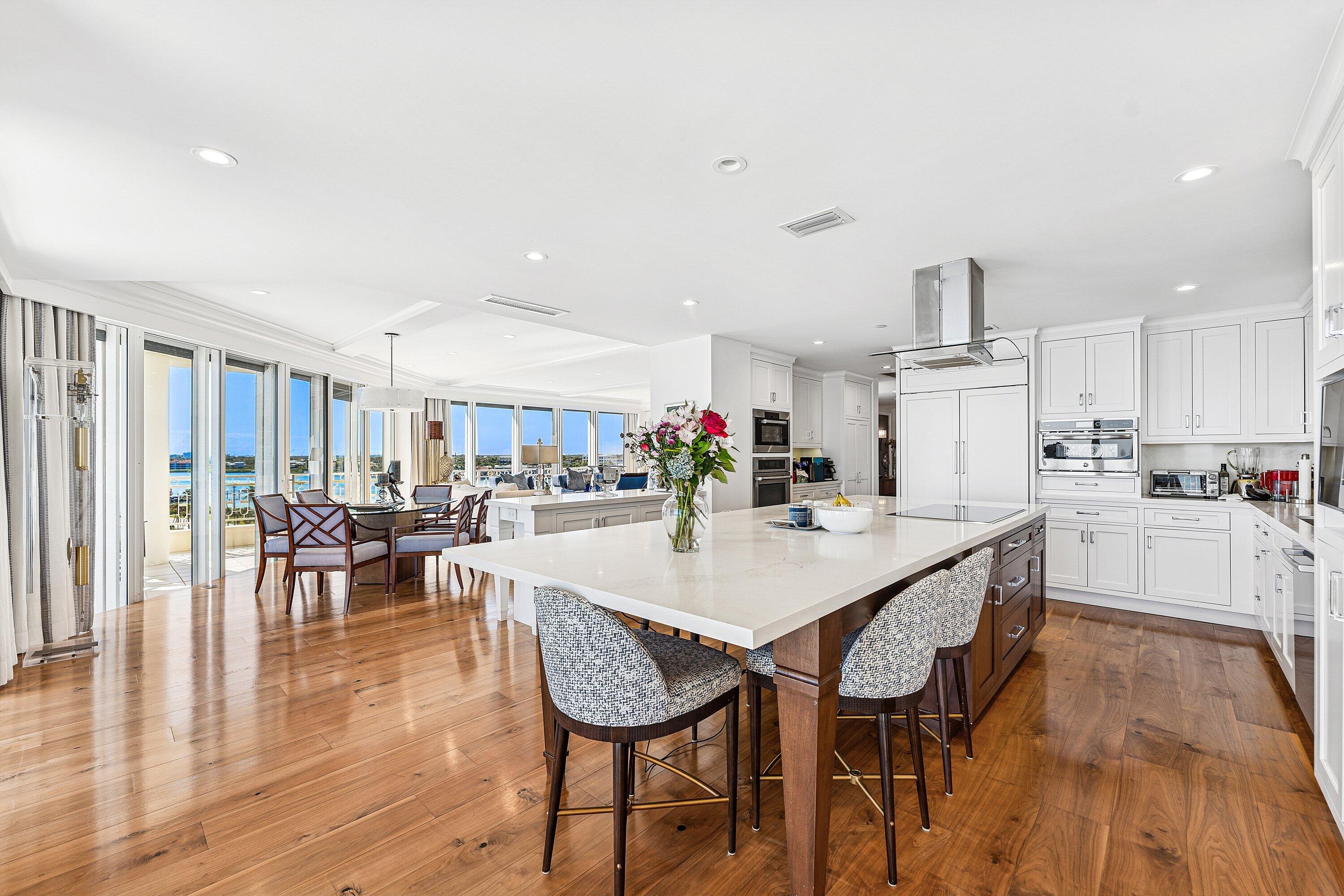19950 South Beach Road, Unit 7S Jupiter, FL 33469 - Photo 12 of 40 a view of a dining room with furniture and wooden floor