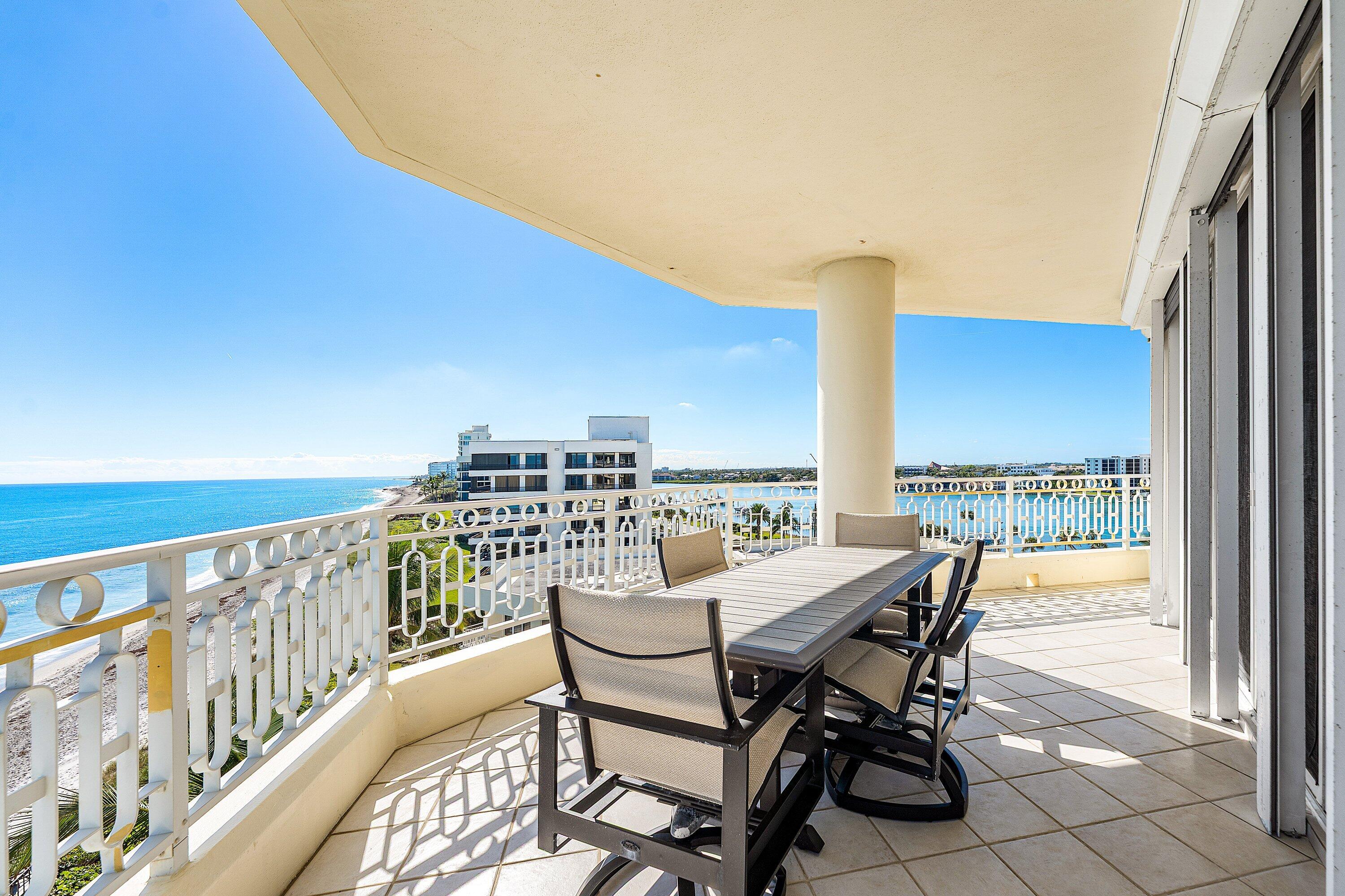 19950 South Beach Road, Unit 7S Jupiter, FL 33469 - Photo 27 of 40 a view of a balcony with table and chairs
