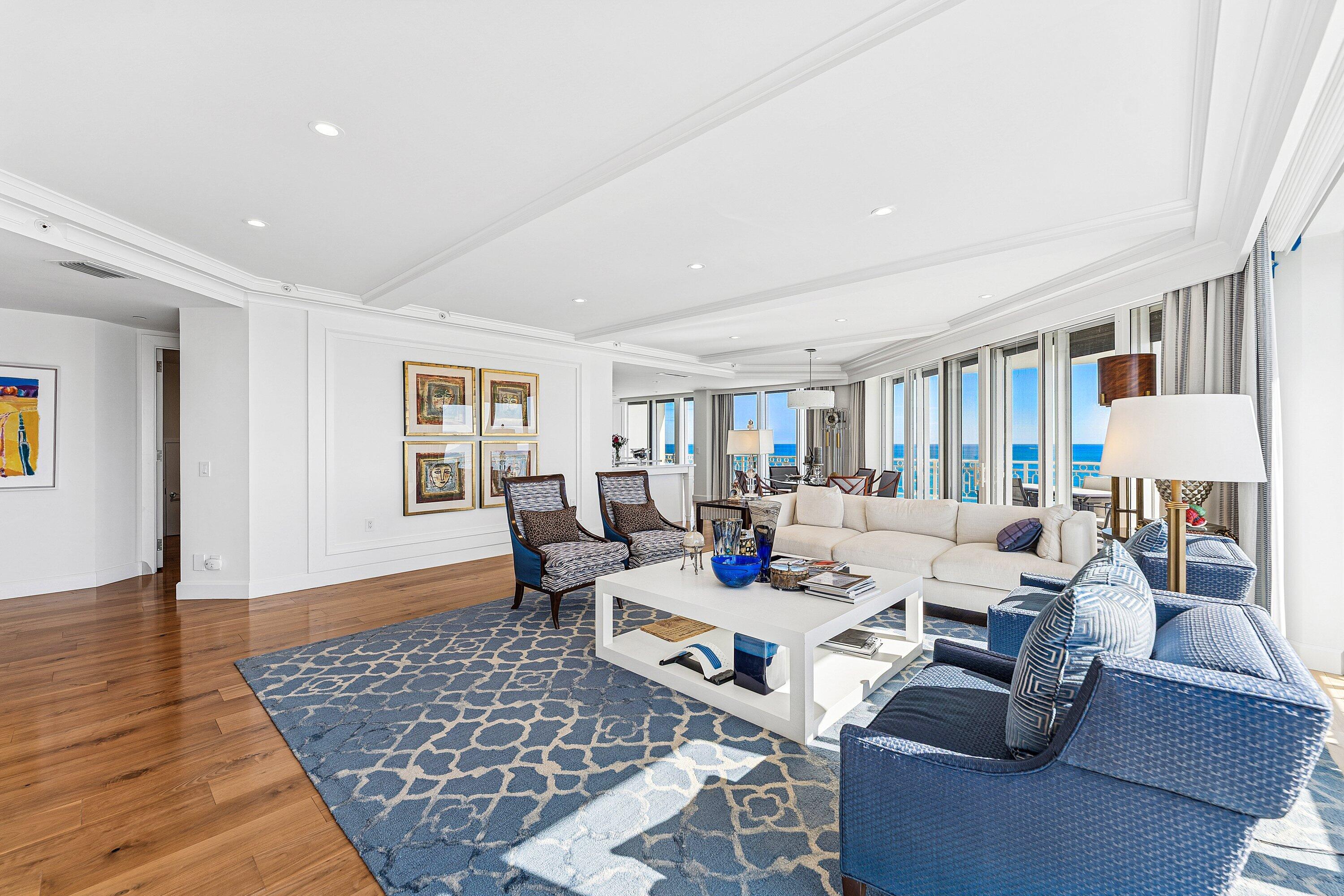 19950 South Beach Road, Unit 7S Jupiter, FL 33469 - Photo 8 of 40 a living room with furniture and wooden floor