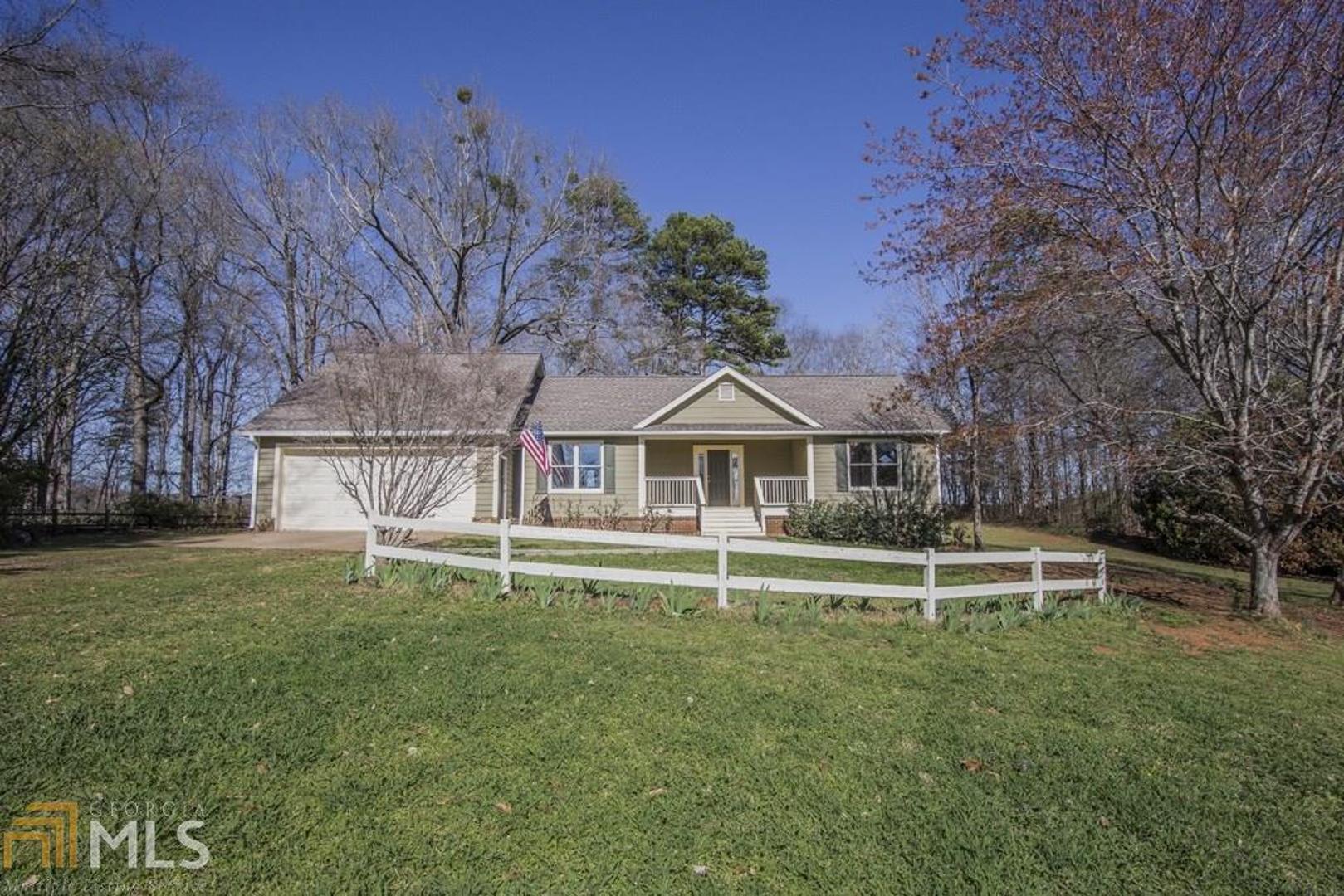 1250 Twin Rivers Road Greensboro, GA 30642 - Photo 1 of 1 a front view of a house with a yard