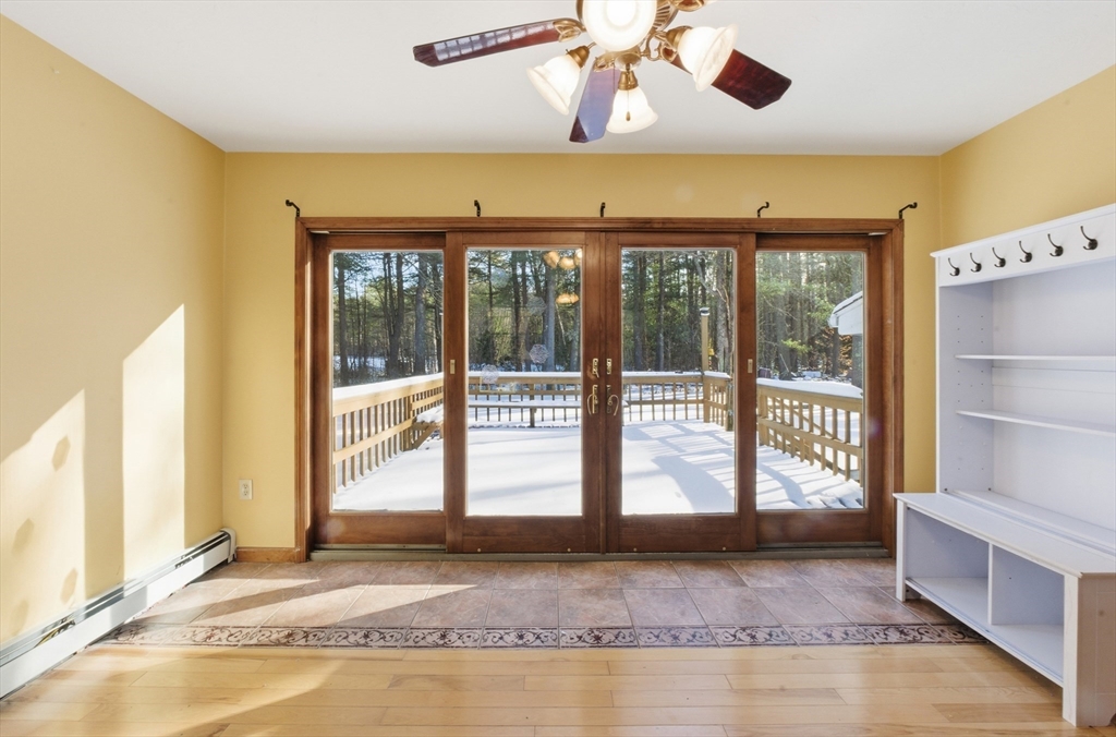 277 Baldwinville Road Templeton, MA 01468 - Photo 12 of 31 a living room with a large window and chandelier
