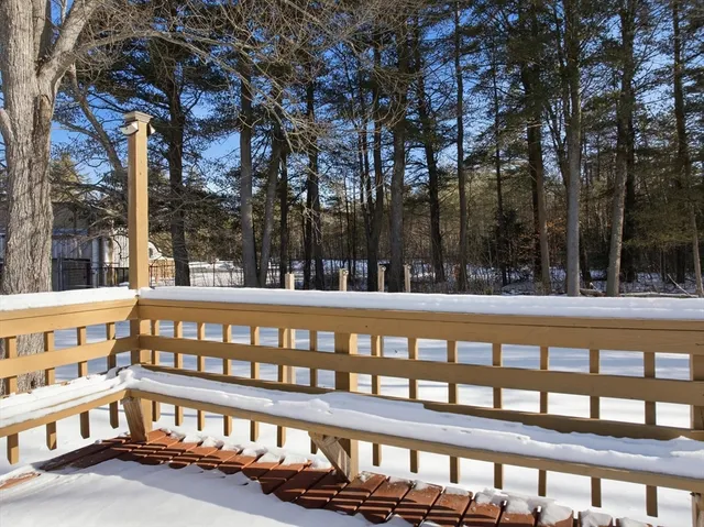 a view of a large white building with a outdoor space