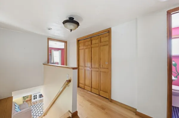 a view of a hallway with windows