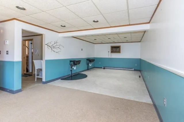 a room with windows and ceiling fan