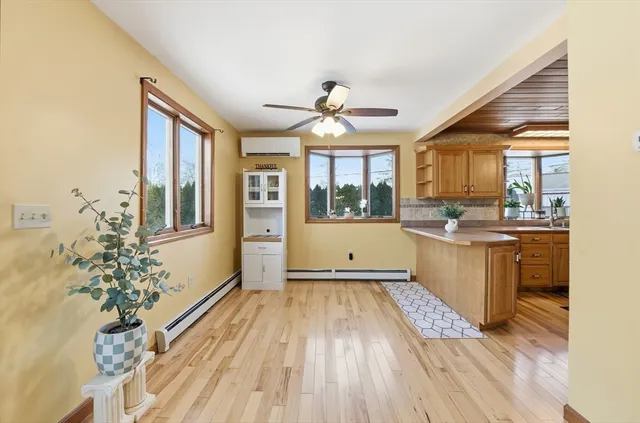 a view of a kitchen with a sink and cabinets