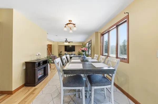 a view of a dining room with furniture and window