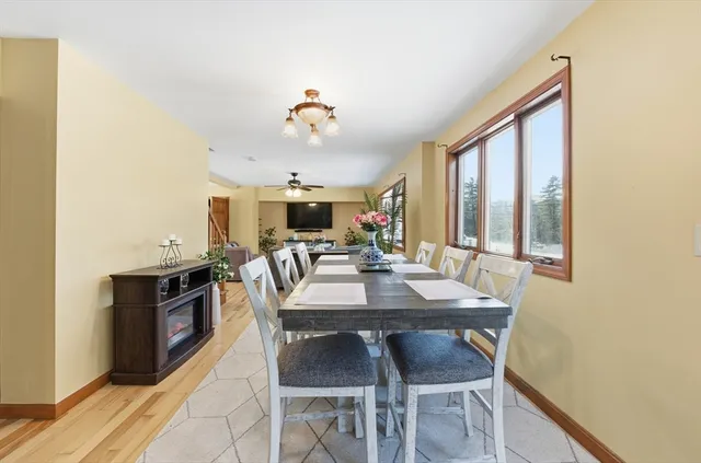 a view of a dining room with furniture and window