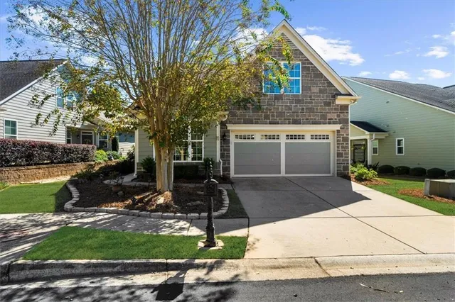 a front view of a house with garden