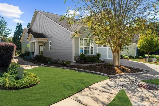 a front view of a house with garden