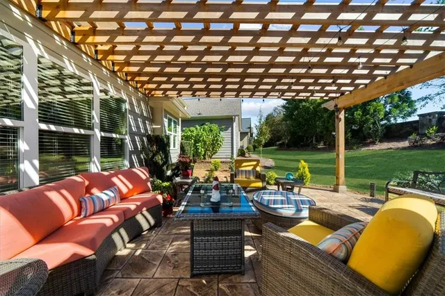 a view of swimming pool with outdoor seating