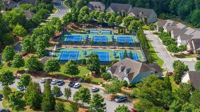 an aerial view of a house with a garden and plants