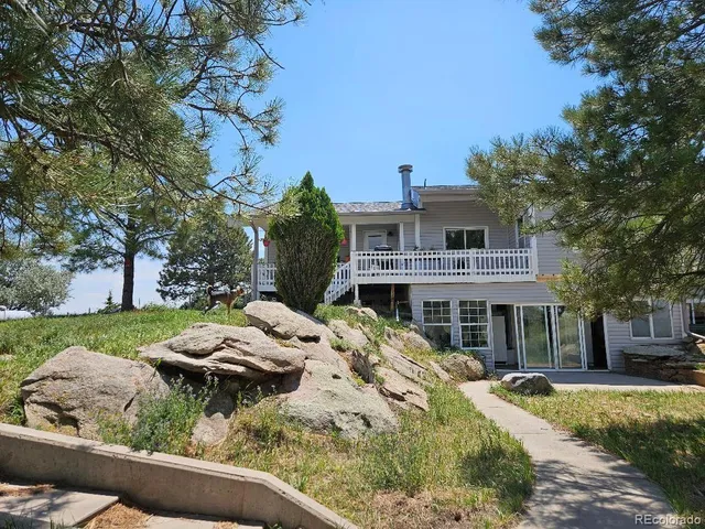 a aerial view of a house with swimming pool and porch
