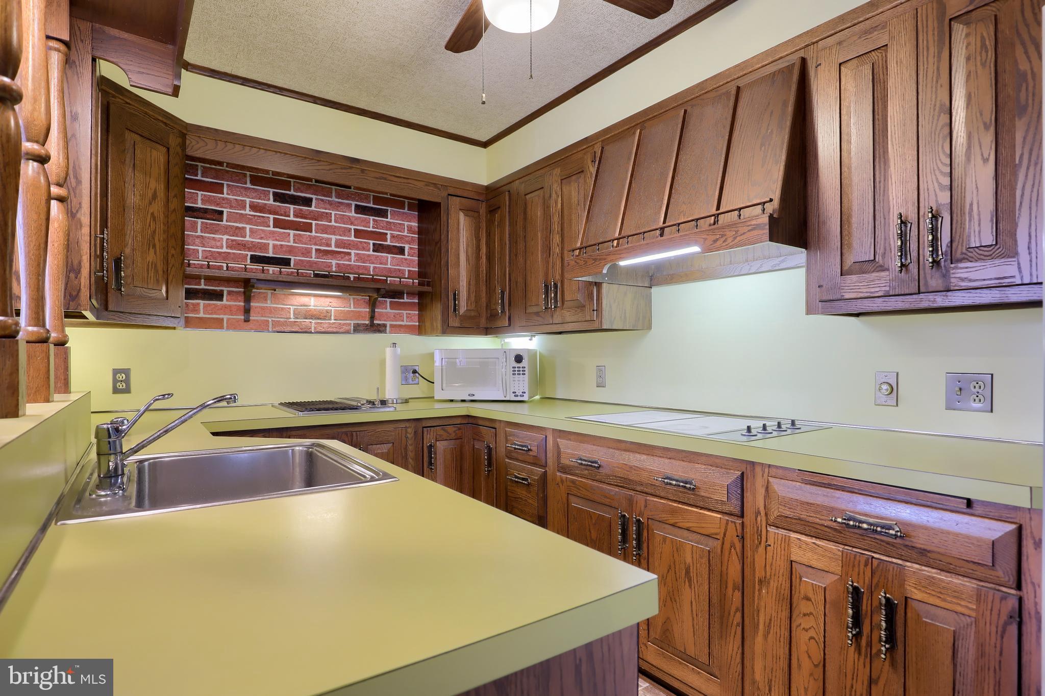620 South Spruce Street Lititz, PA 17543 - Photo 26 of 57 a kitchen with a sink a stove and cabinets